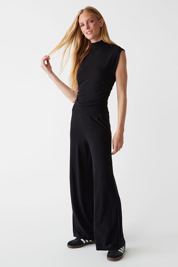jersey dress pants Styling the Uniqlo Jersey Barrel Leg Trousers 3 ways , Keeping the silhouette relaxed but intentional because barrel legs deserve balance., Look 1: Striped polo for that effortless preppy vibe., Look