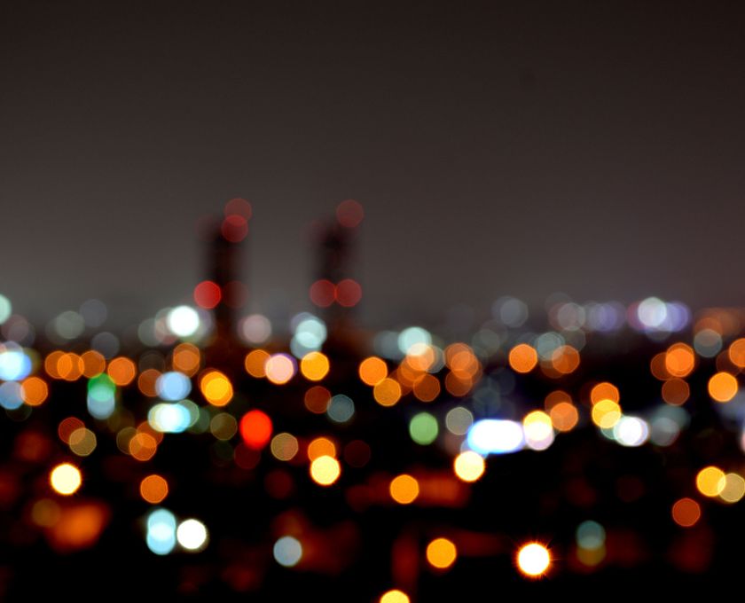 Blurred cityscape at night with colorful lights