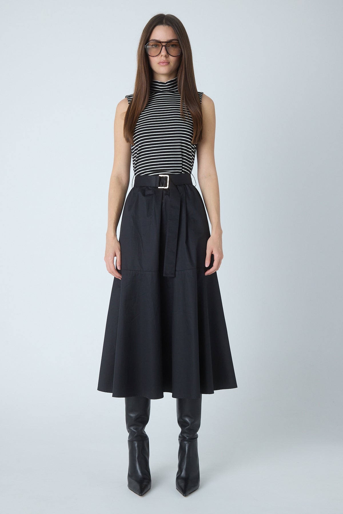 Model wearing the Nara black mixed media mock neck dress by JS71